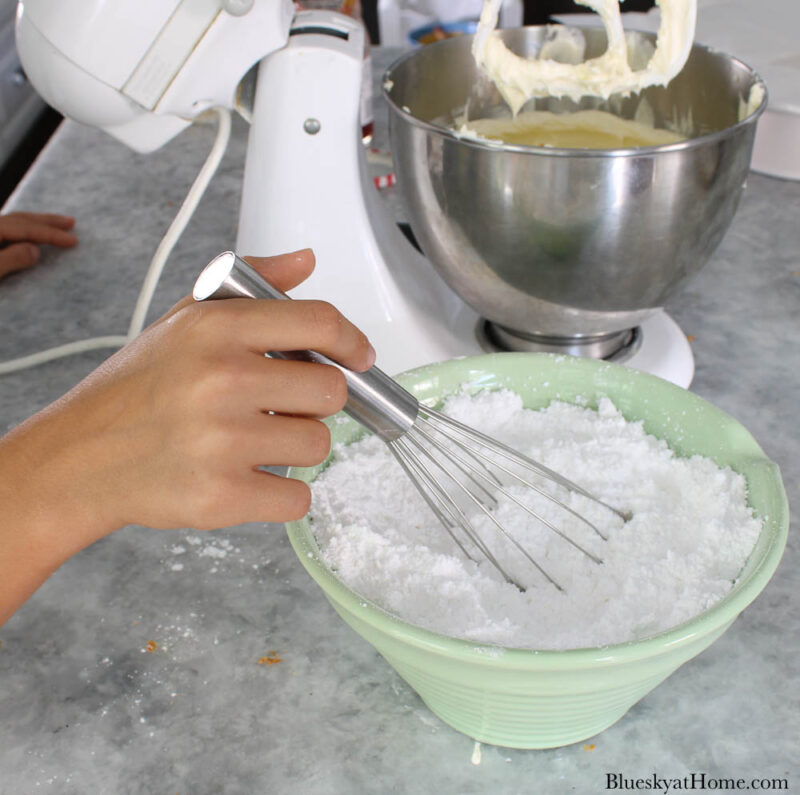 powdered sugar in green mixing bowl