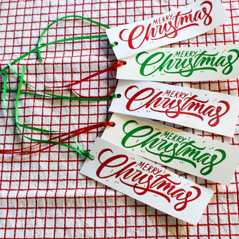 Christmas bookmarks with Merry Christmas and red and green ribbon