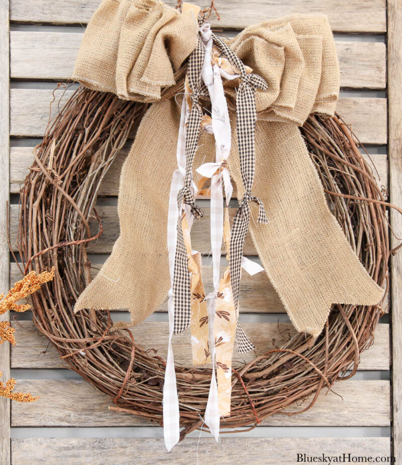 grapevine wreath with burlap bow and fabric