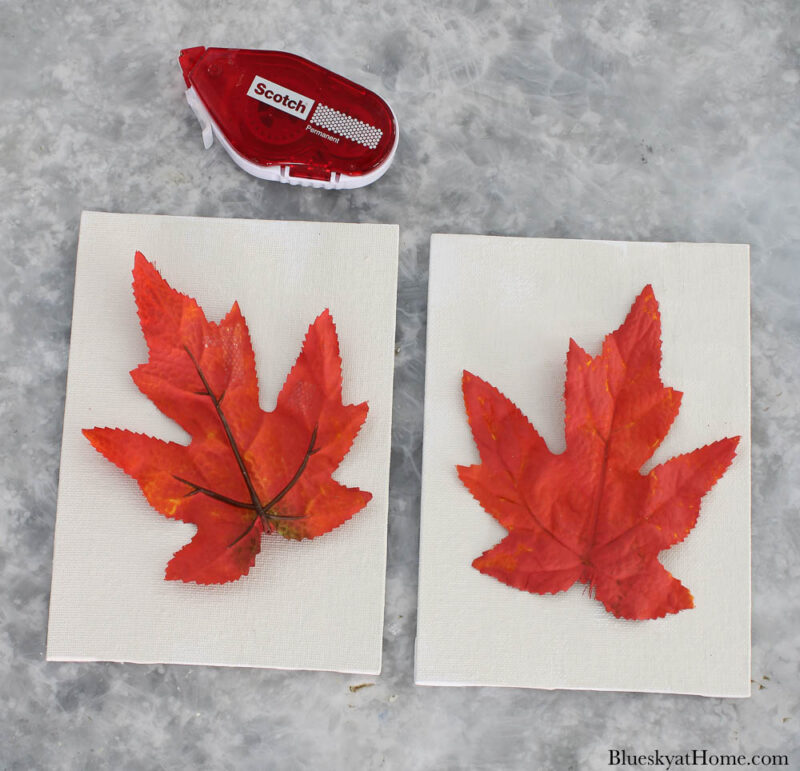 orange painted faux maple leaves on canvas