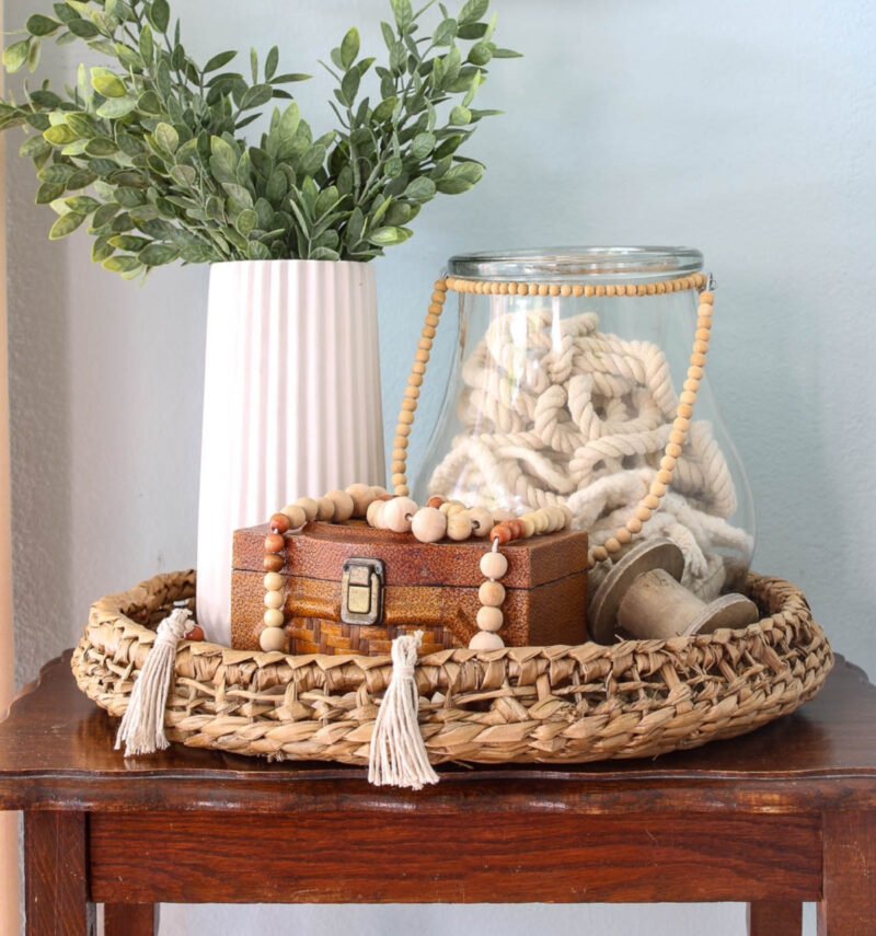glass vase with fall accents and wooden beads