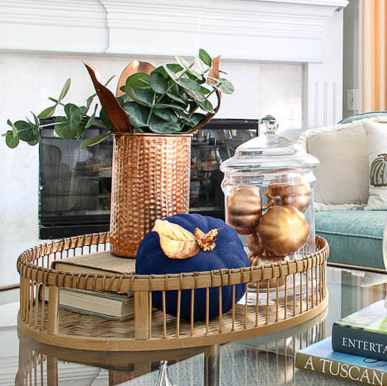 fall accessories in the living room in blue and copper