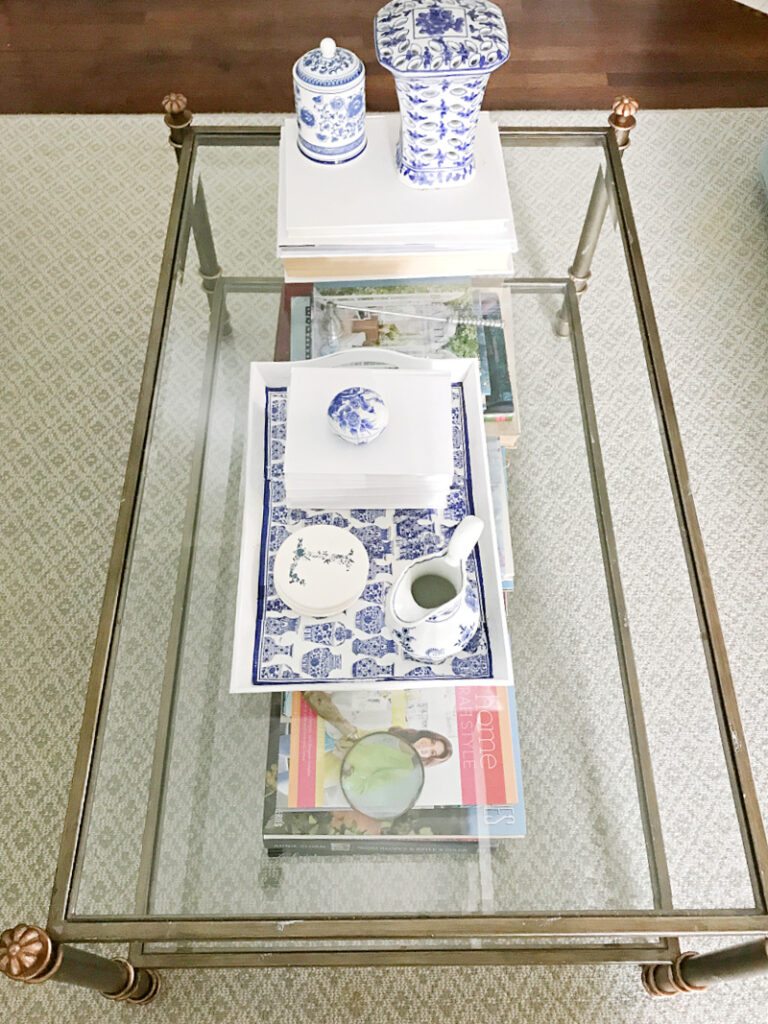 coffee table with blue and white items