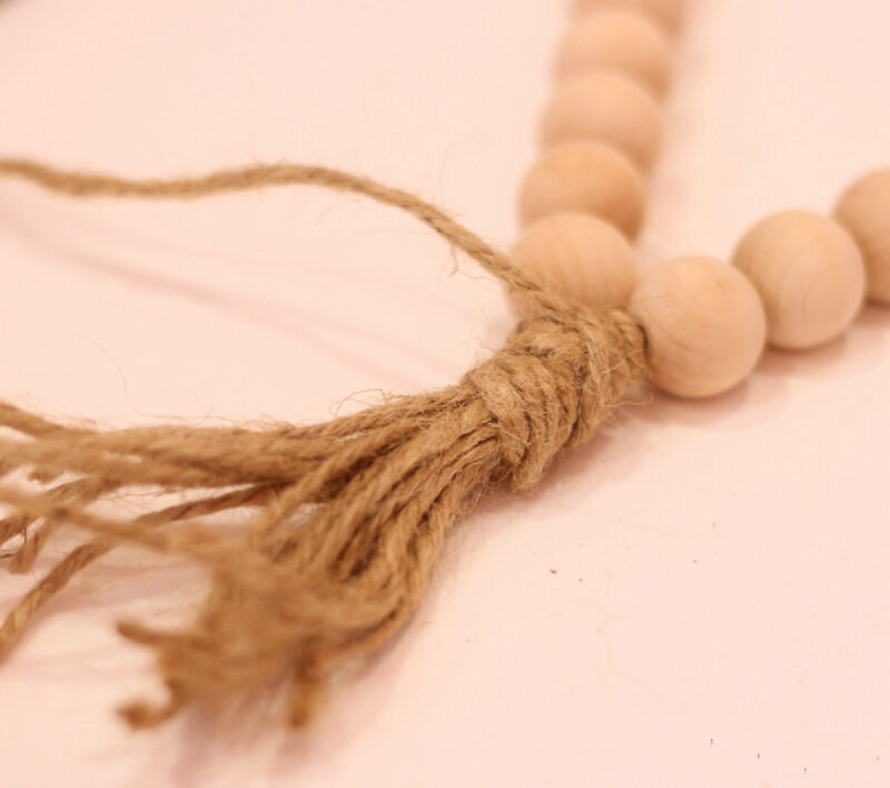 wood beads with twine and tassel
