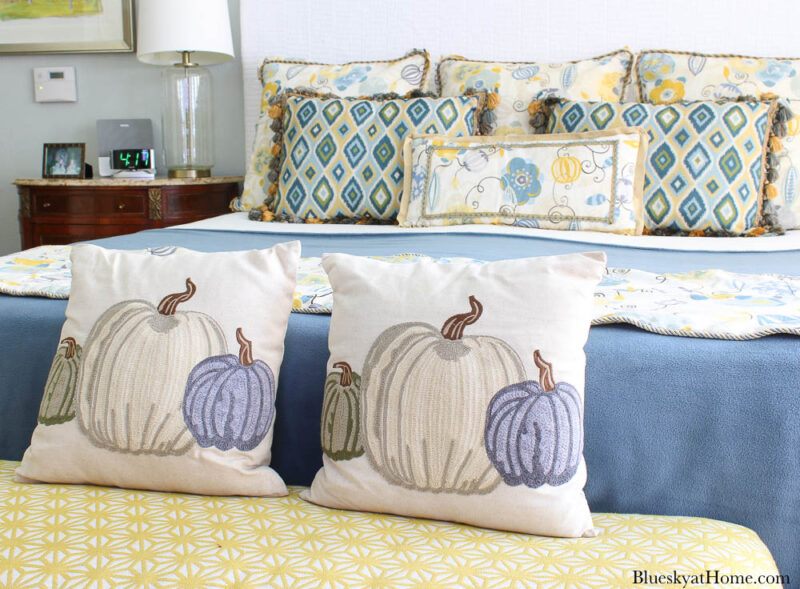 pumpkin pillows on yellow bench cushion