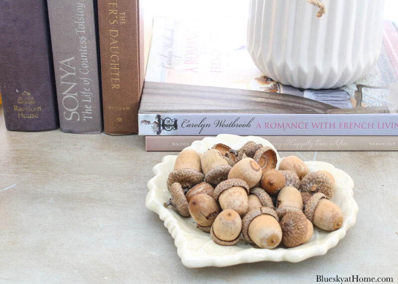  white leaf dish filled with acorns