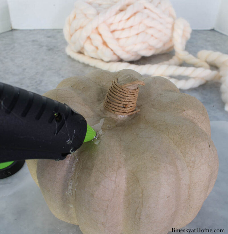 adding glue to pumpkin