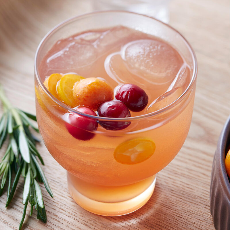 fall cocktail with cranberries and kumquat