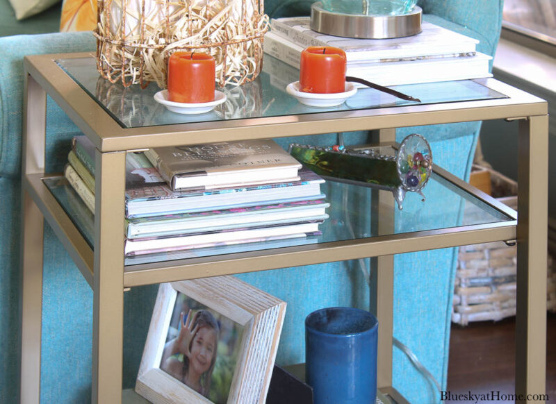 glass and metal end table with three shelves