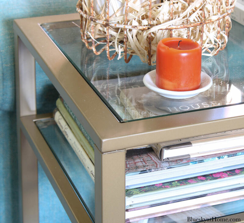 glass and metal end table with three shelves