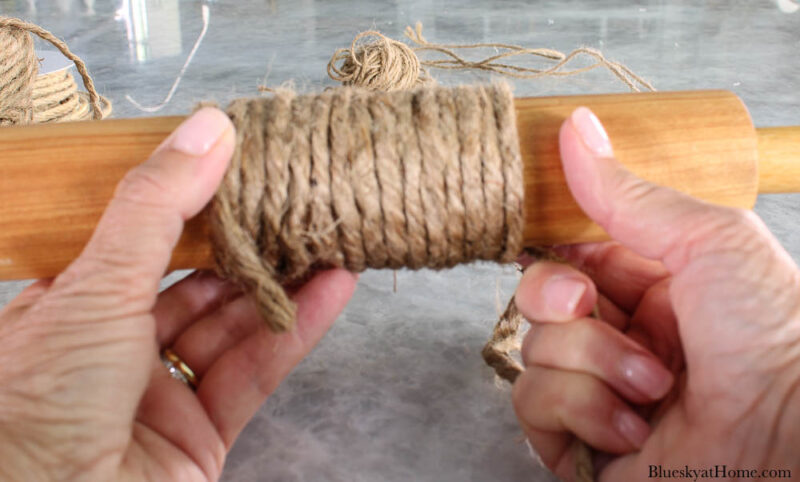 wrapping thick twine around rolling pin