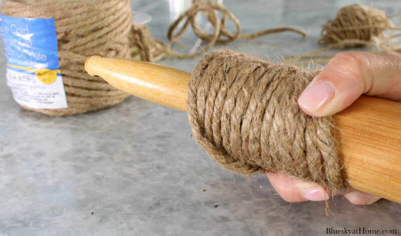 wrapping thick twine around rolling pin