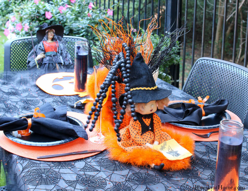 Halloween tablescape on the patio with witches