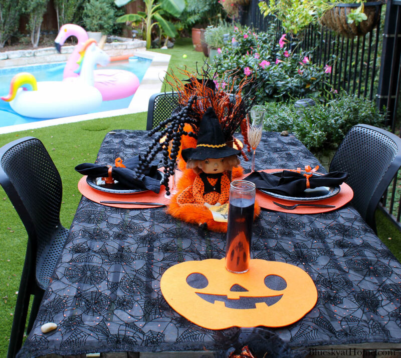 Halloween tablescape on the patio with witches