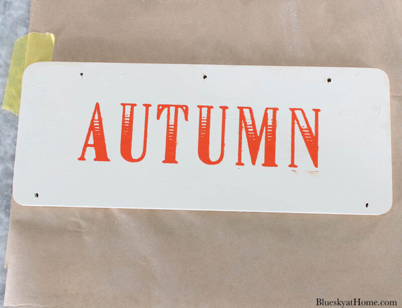 wood sign with word autumn