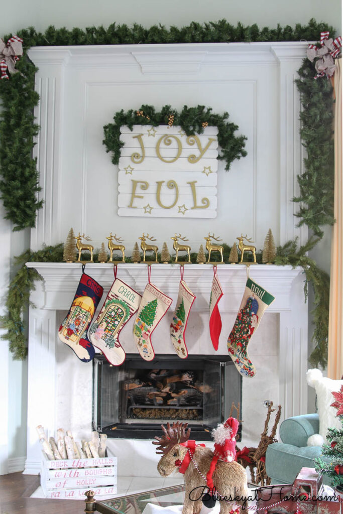 fireplace decorated with garland