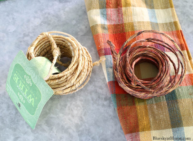 two rolls of wired twine and plaid napkin