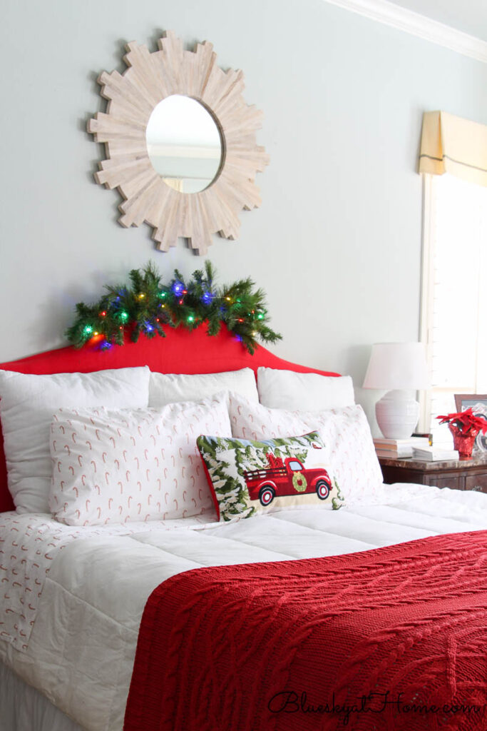 master bedroom with garland on headboard