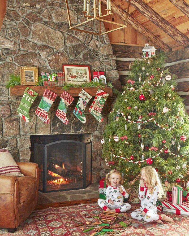 rustic living room with fireplace and Christmas tree