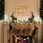 fireplace decorated with garland