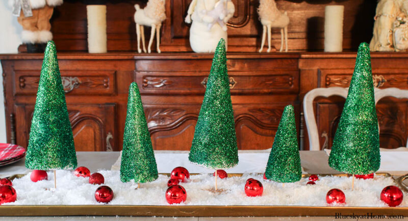 green glitter Christmas trees on table