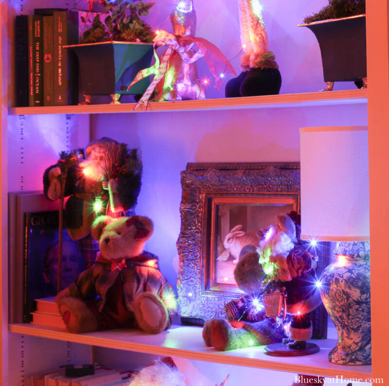 festive bookcase lighted for Christmas