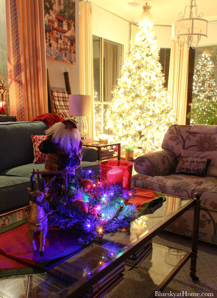 festive living room and Christmas tree lighted for Christmas