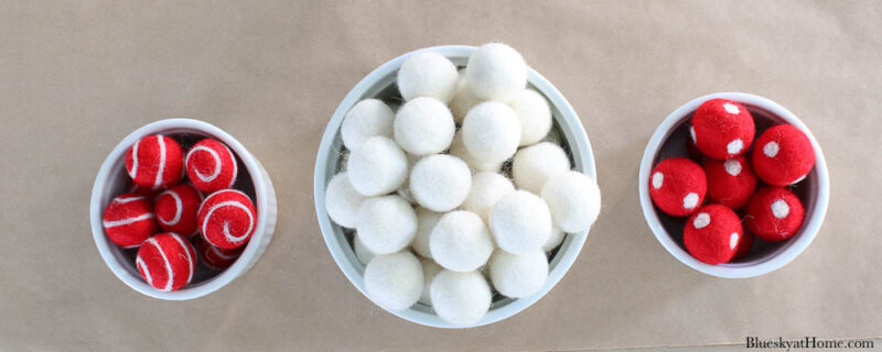 bowls of red and white felt balls