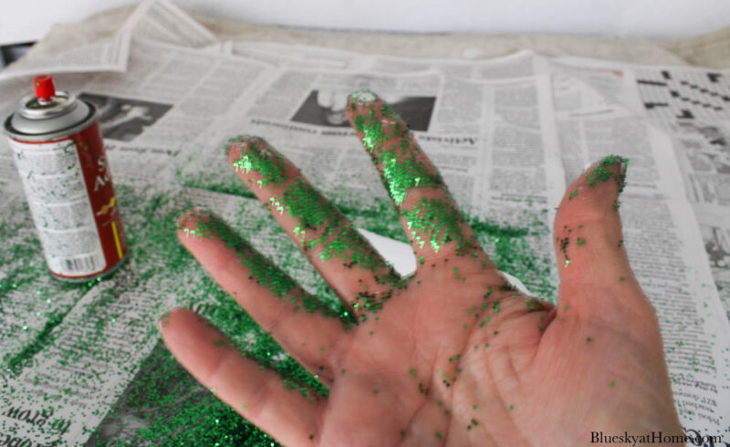 hand with green glitter