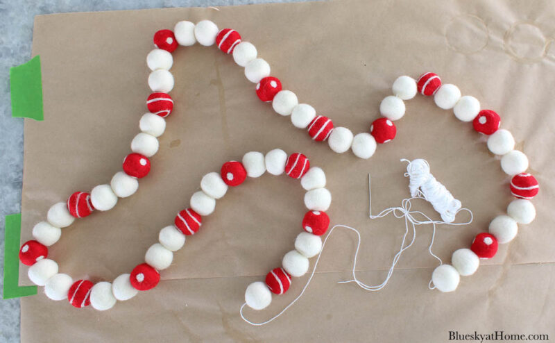 felt ball garland in white and read polka~dots and swirls