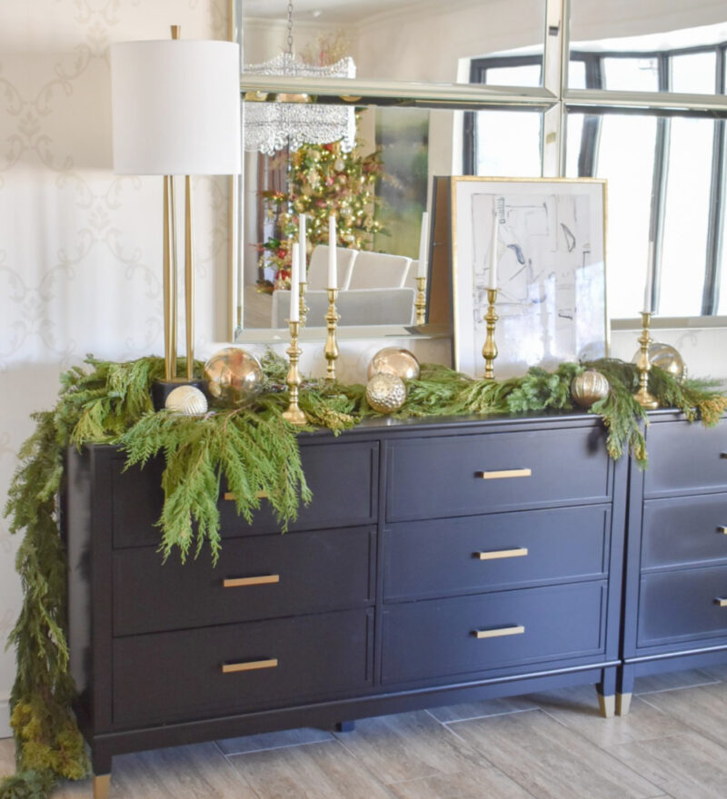 blue sideboard with Christmas greenery