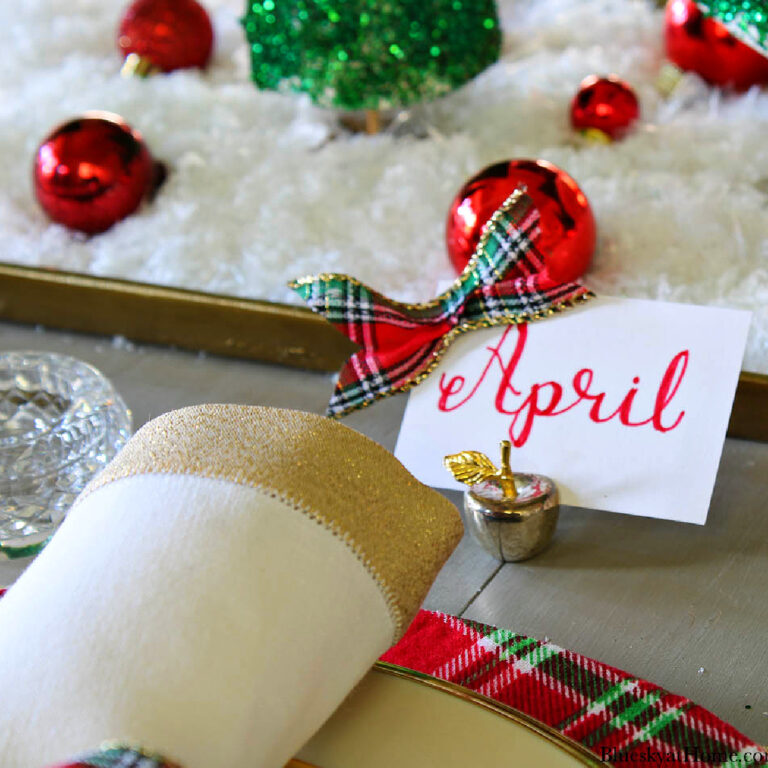 red plaid christmas table with placecards
