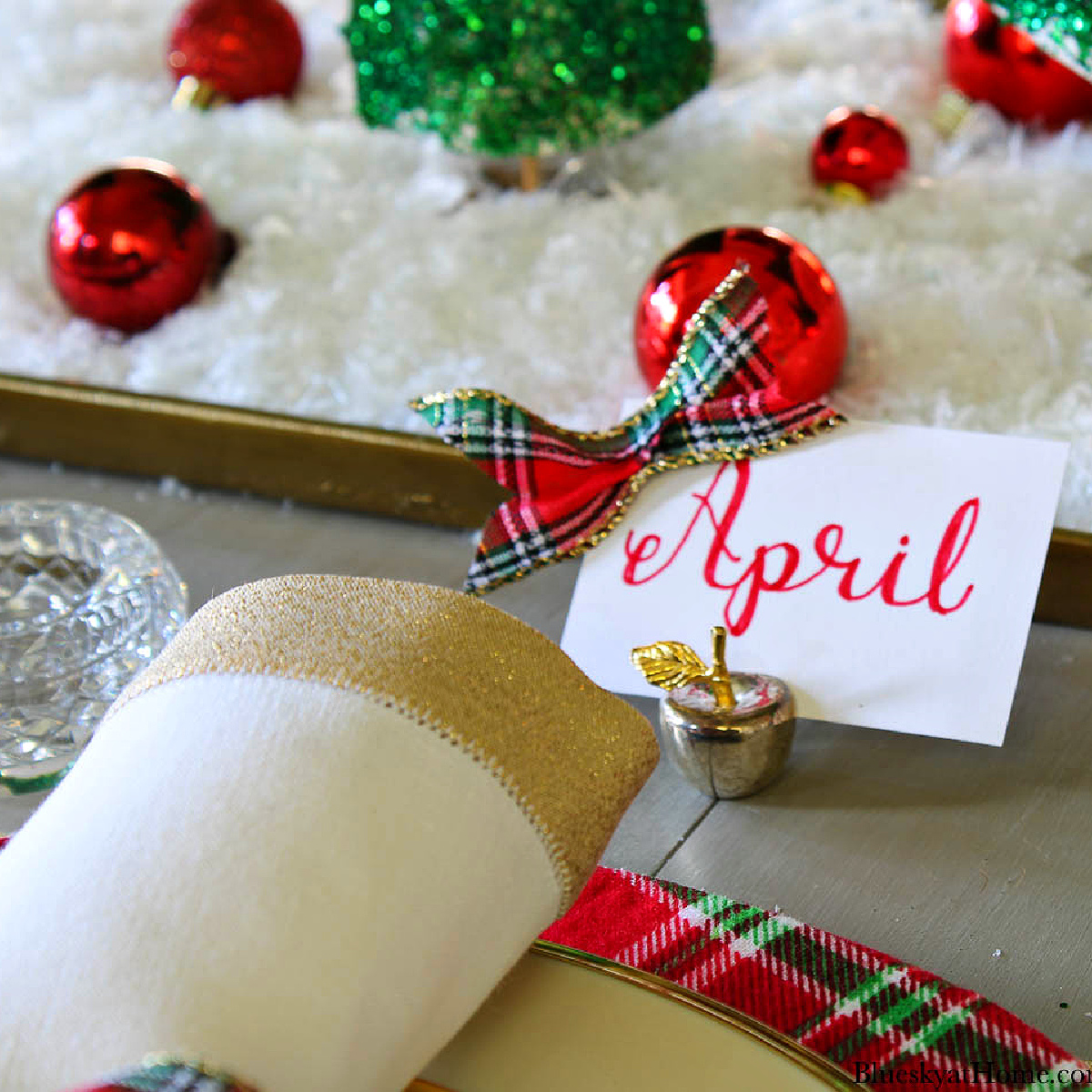 red plaid christmas table with placecards