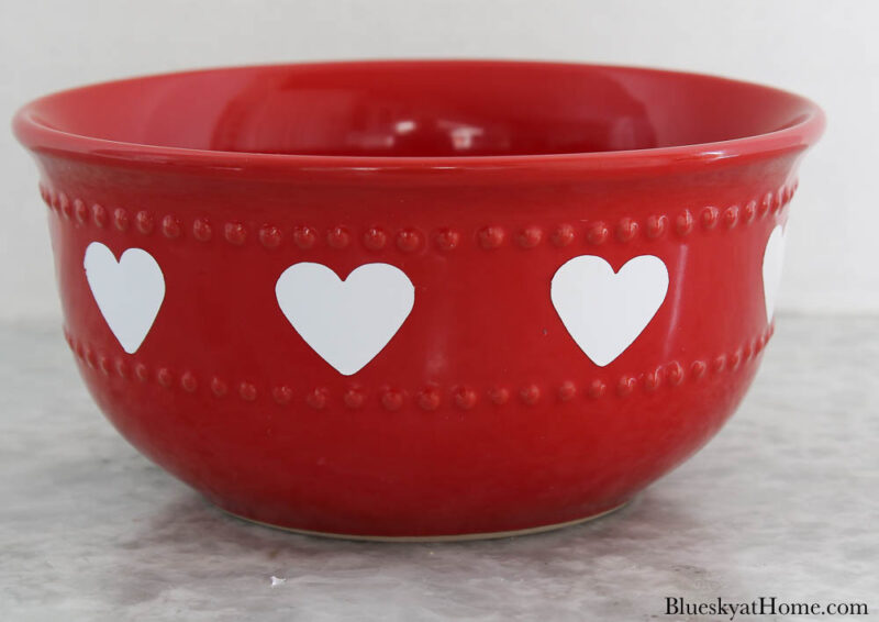 red bowl with white heart stickers