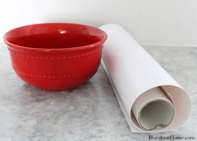 red bowl with white vinyl