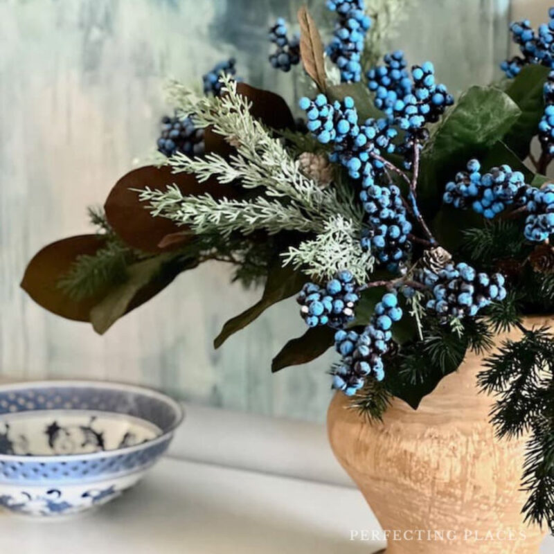 flower flowers in rustic pot with blue patterned bowl