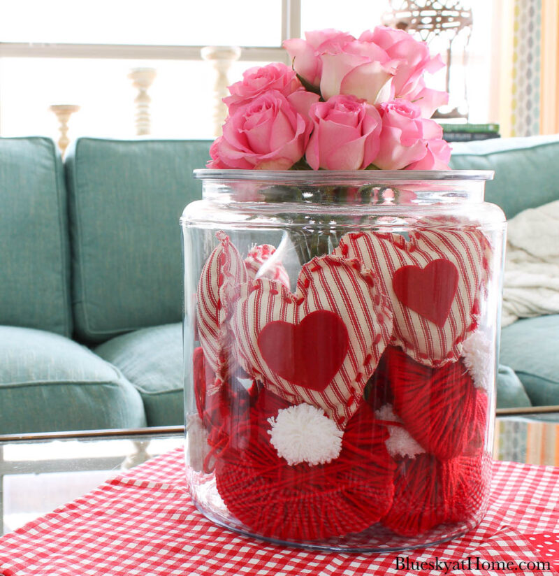 large apothecary jar with Valentine hearts and pink roses