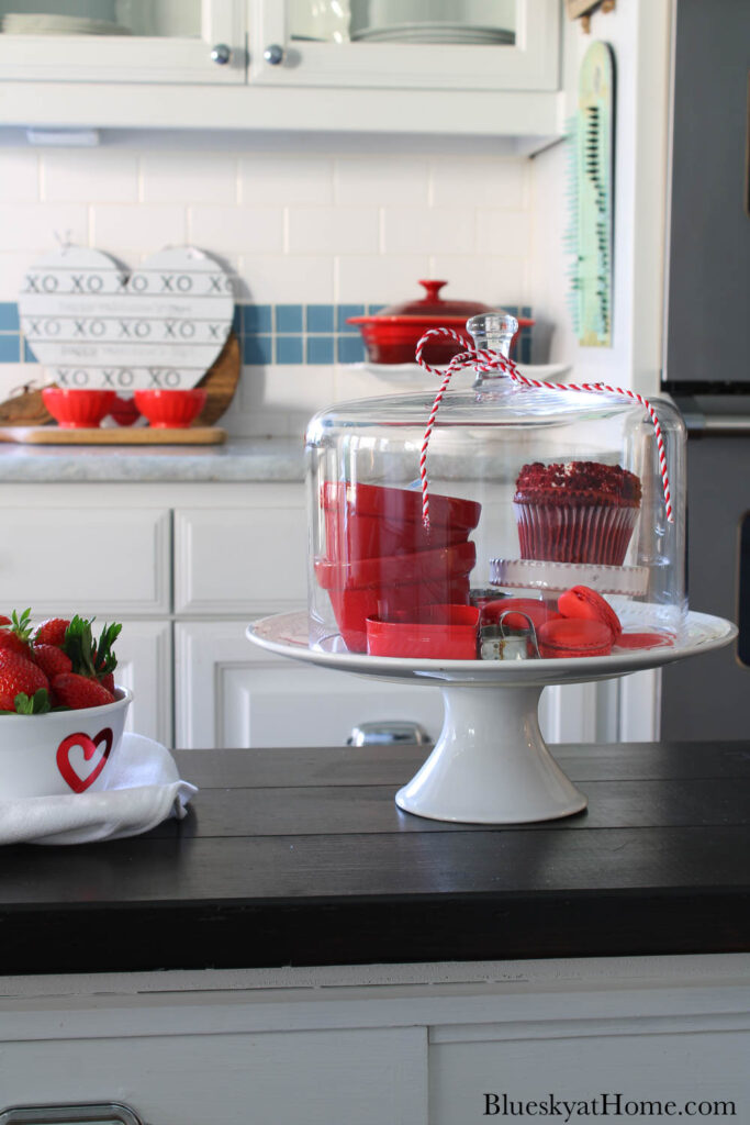 Valentine vignette on cake stand on kitchen table