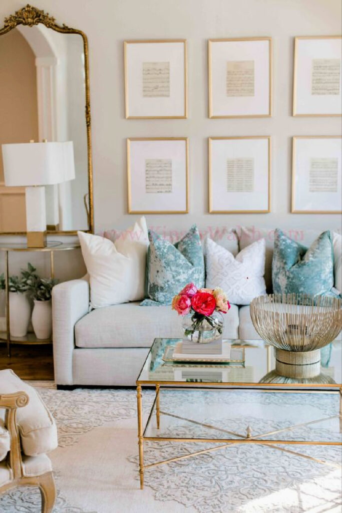 living room with gallery wall and glass and metal coffee table