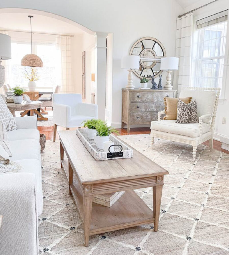 family room in shades of white with wood coffee table