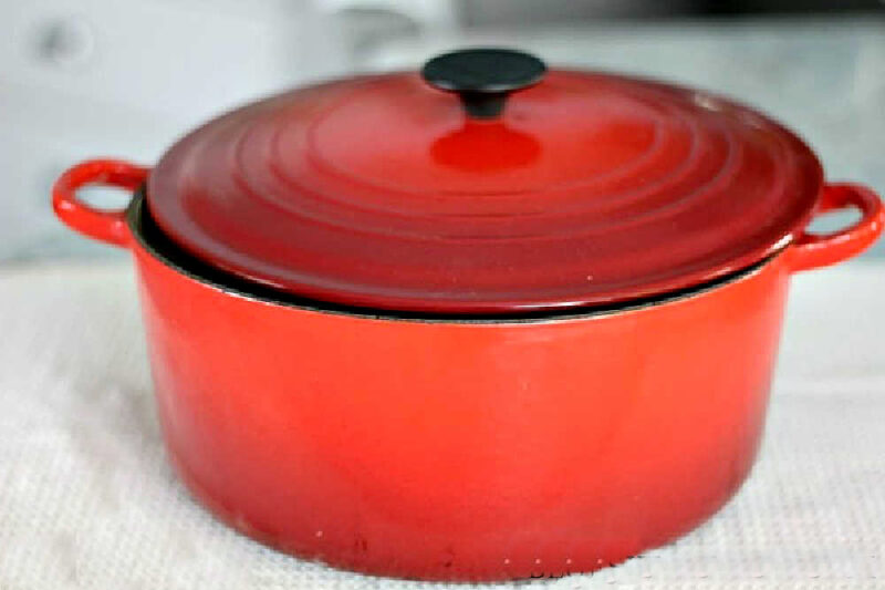 red Le Creuset Dutch oven for making soup