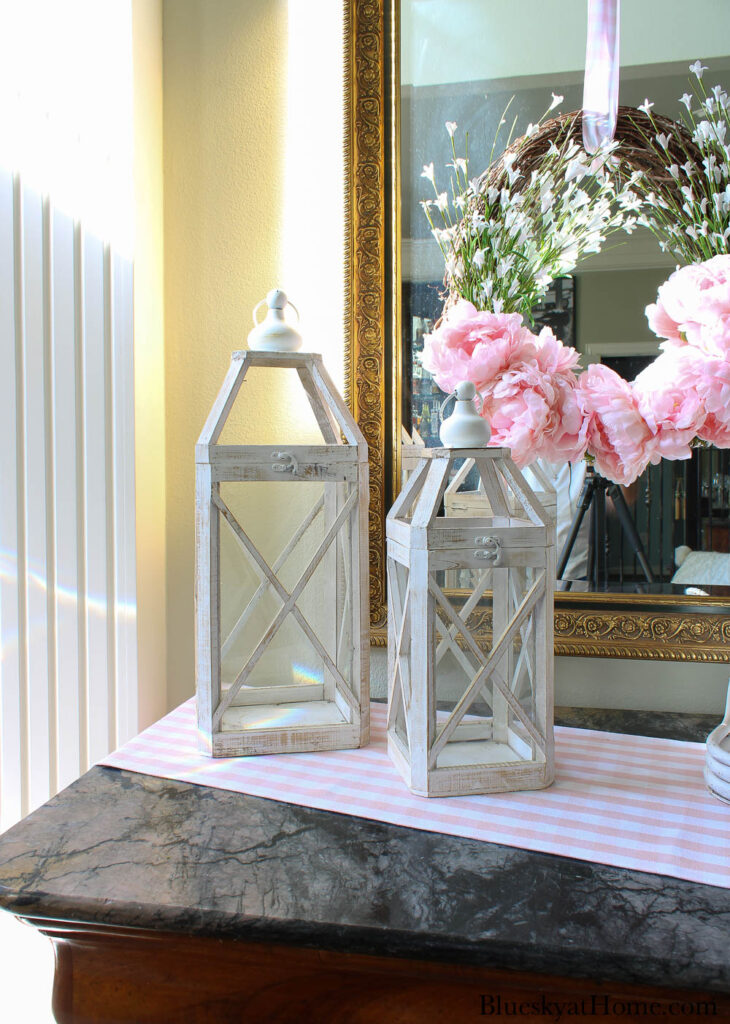 two white wood lanterns