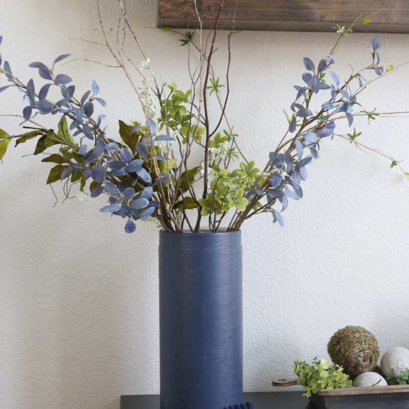 blue vase with blue flowers