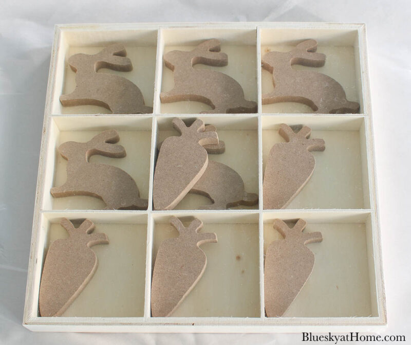 wooden tray with Easter bunnies and carrots