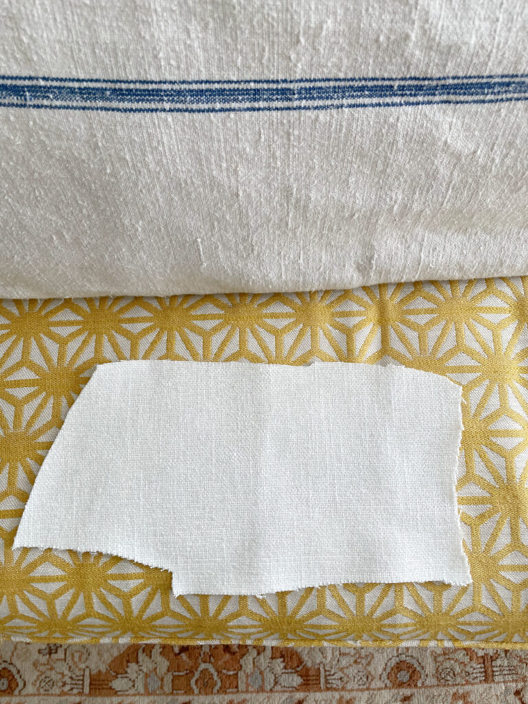 white fabric on yellow cushion