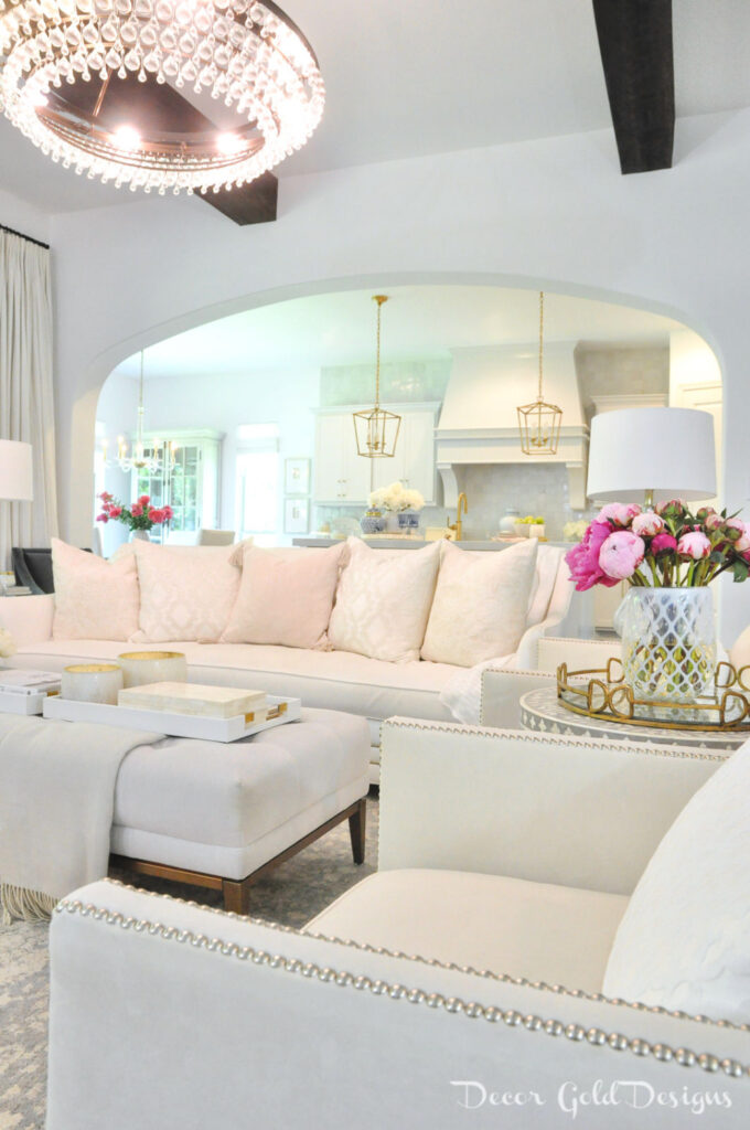 summer decor with white sofas and pink pillows