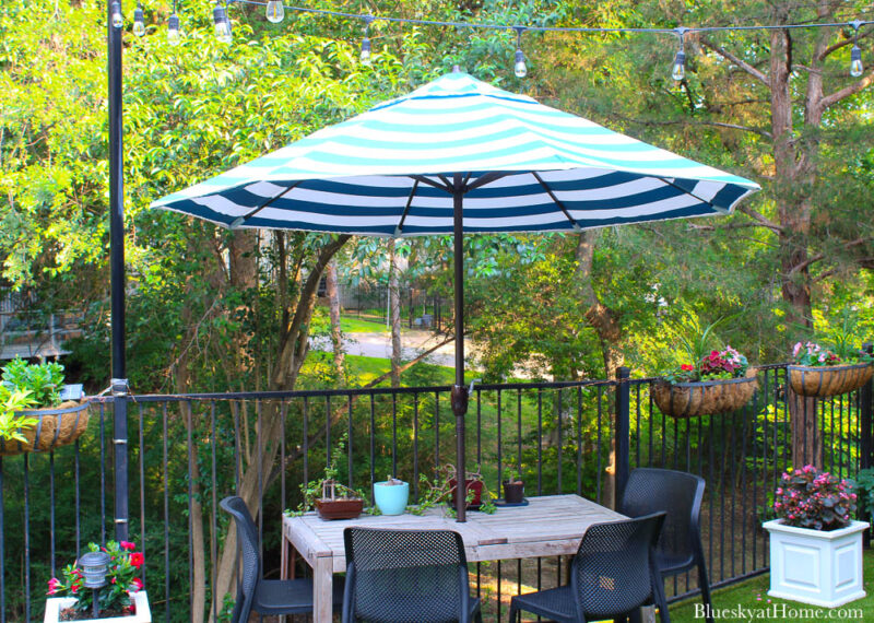 outdoor teak dining table with umbrella