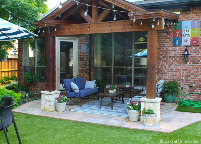 patio seating area with wood and stone