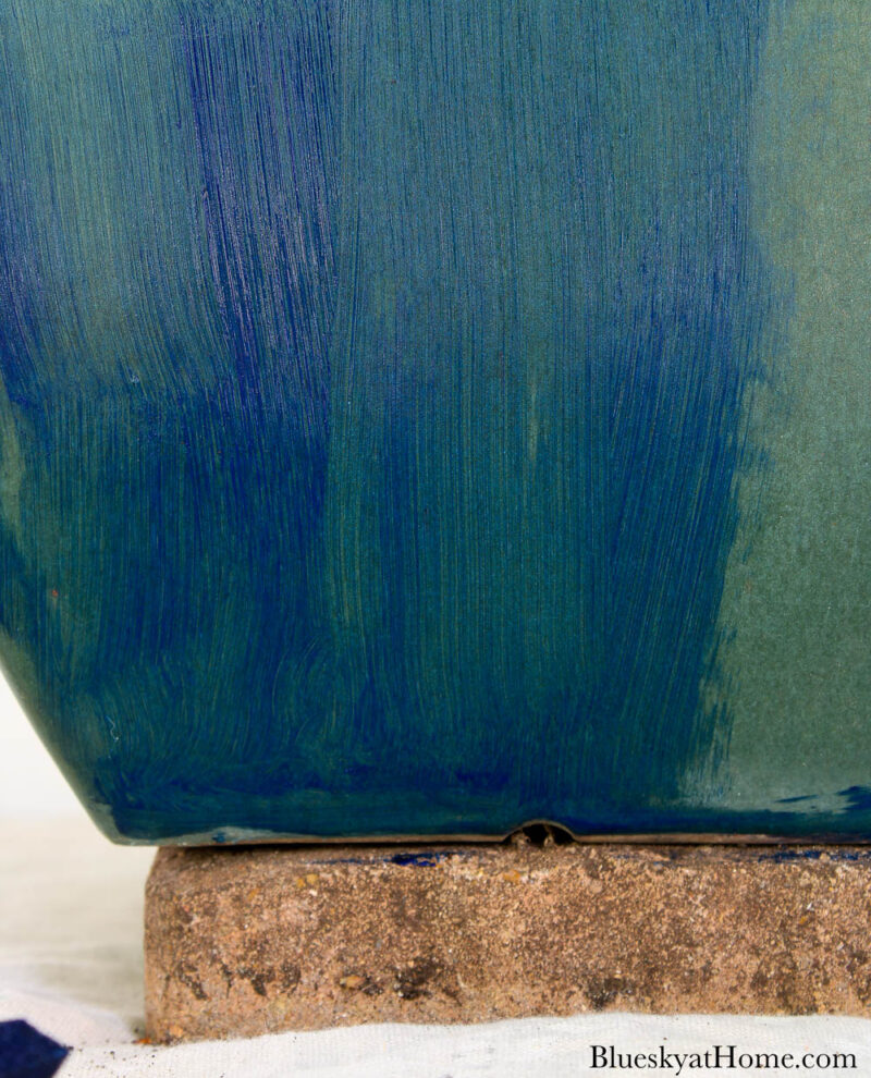 painting ceramic planter with blue paint