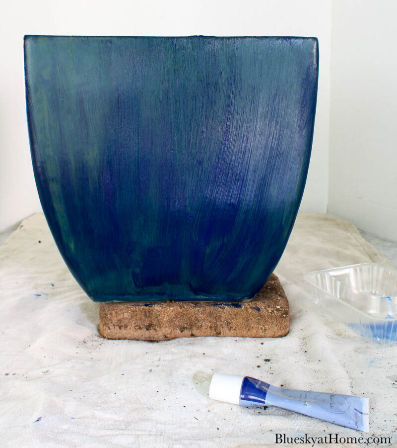 painting ceramic planter with blue paint